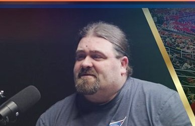 DJ Wrekk speaking into a microphone during a Legends 34 taping.